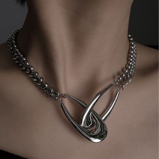 A Niche Design For A Double Ring Interlocking Necklace